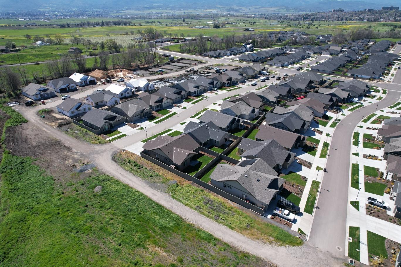 Aerial view of a Rogue Valley residential development with homes built by Spence Construction crews